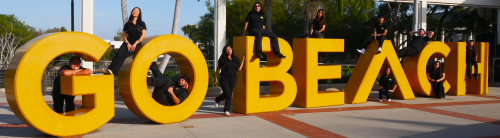 President's Ambassadors at the Go Beach sign.