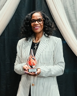 Provost Karyn Scissum Gunn with award
